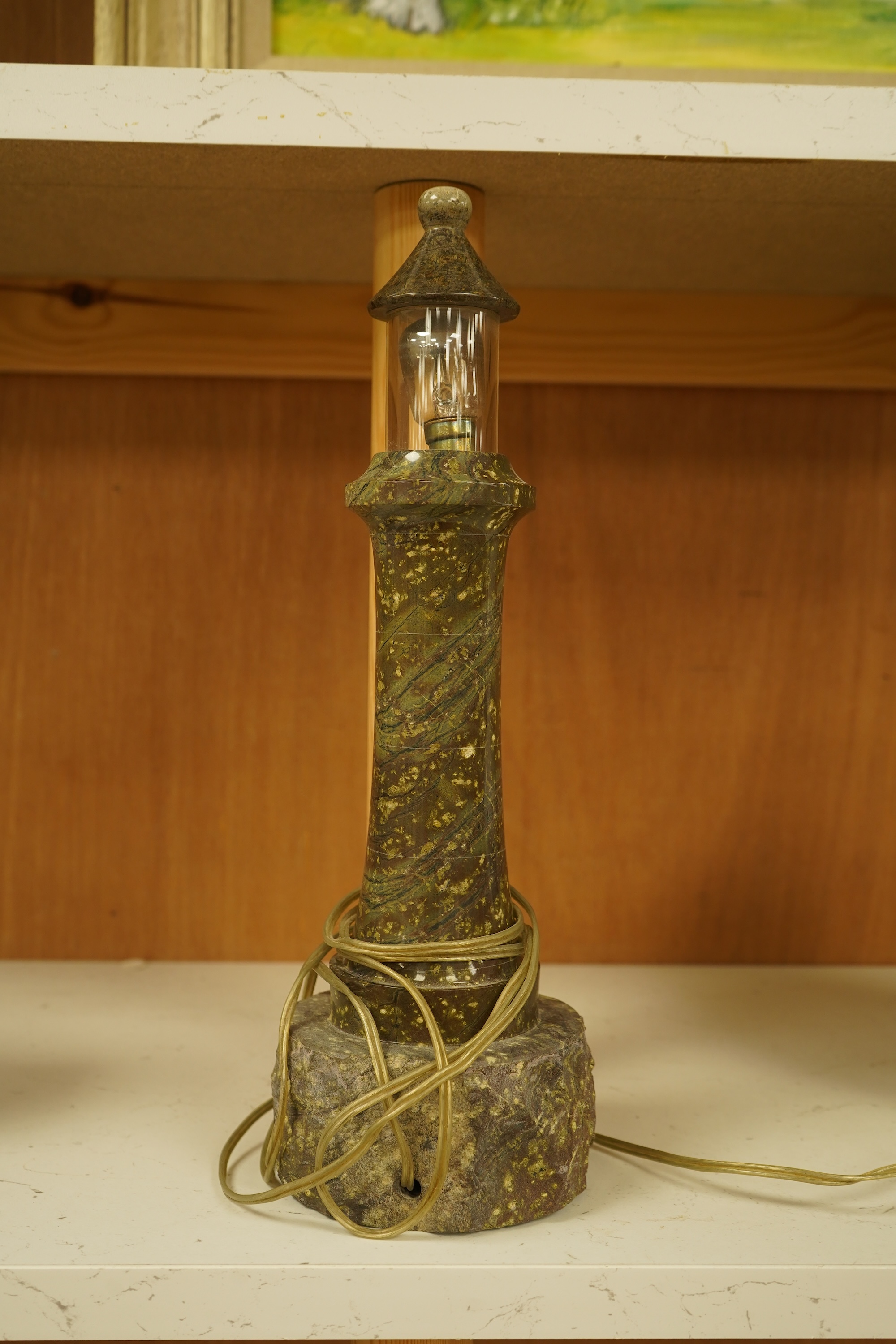 A Cornish serpentine lighthouse table lamp, 33cm high
